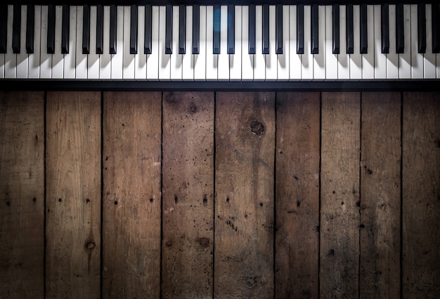 piano on wooden background closeup ,concept musical instruments