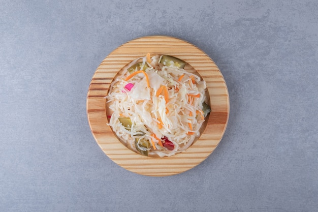 Pickled vegetables mix in the wooden plate