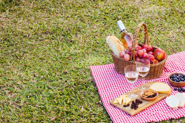 Picnic basket on kitchen cloth with copy space