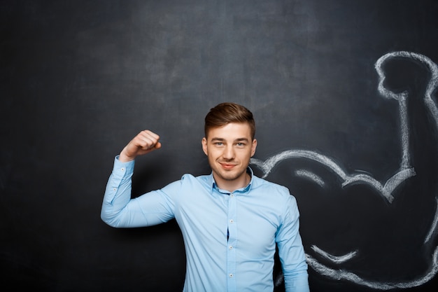 Free Photo picture of  funny man with  fake muscle arm