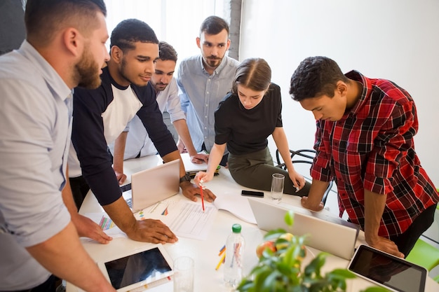 Picture of serious and executive office workers doing their job on board room in officeinterior Business people working round table in office Business plan and business project concepts