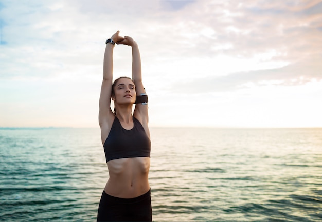 Picture of young beautiful fitness woman makes sport exercises