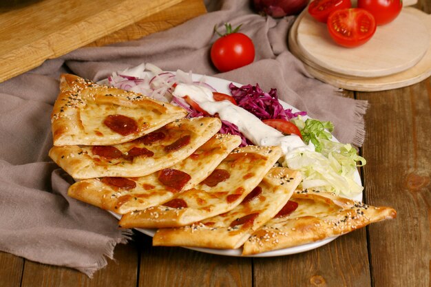 Pide with sausages on the table