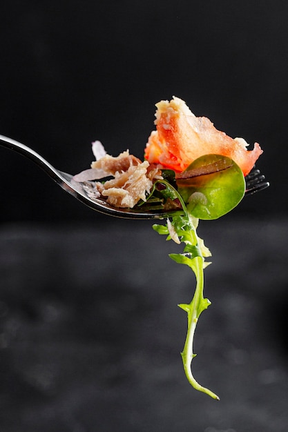 Free Photo piece of salad on fork close-up