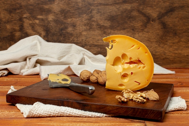 Free Photo piece of tasty cheese on a board