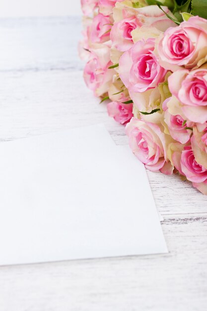 Pieces of paper next to a bouquet