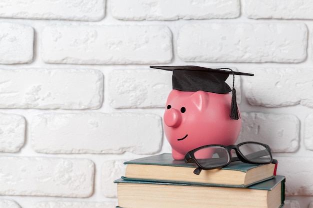 Piggy bank on top of books