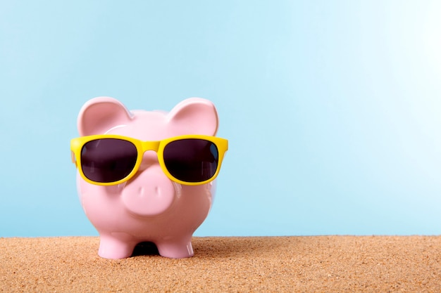 Piggybank with yellow sunglasses