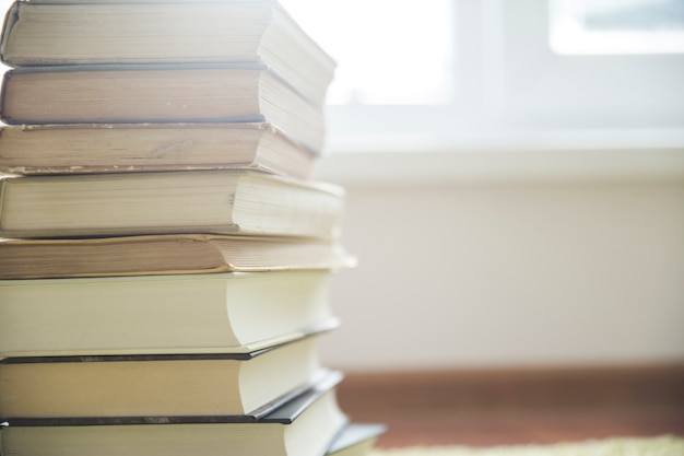 Pile of books on floor