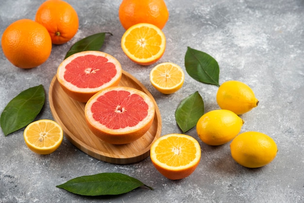 Pile of fresh fruits on grey surface. 