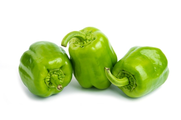 Pile of fresh organic peppers isolated on white surface. 