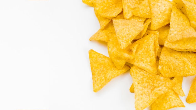 Pile of nachos on white background