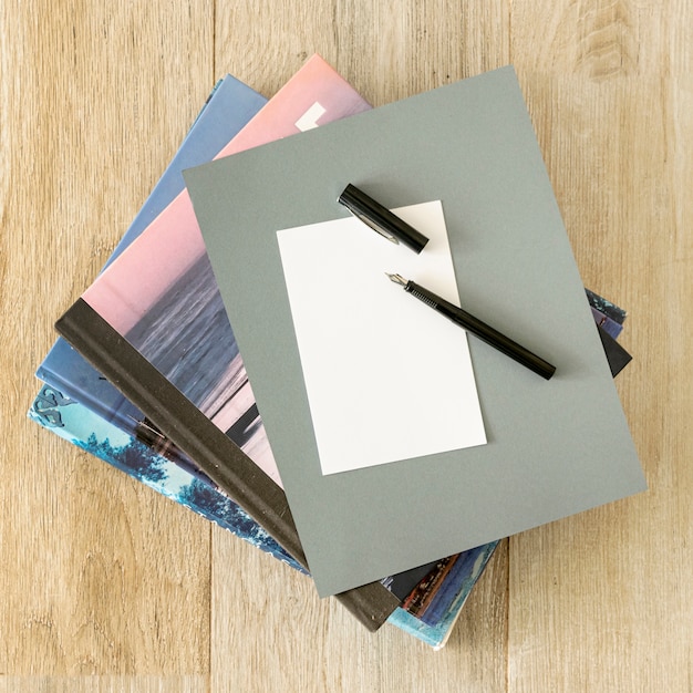 Free Photo pile of notebooks on wooden background