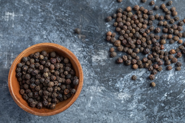 Pile of pepper grains on marble.