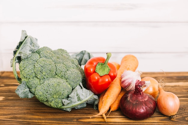 Pile of raw vegetables on table