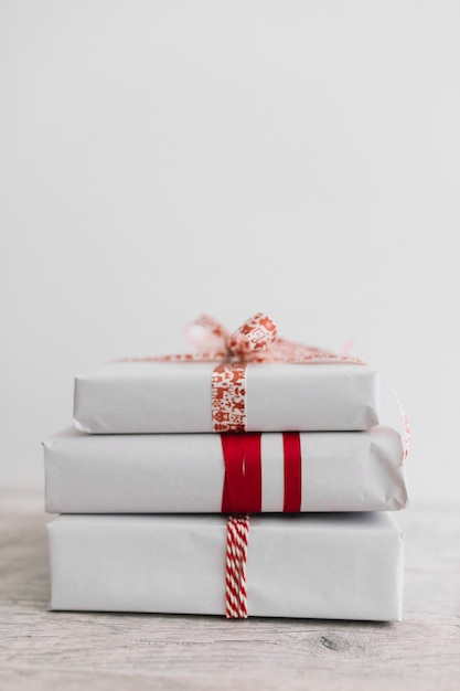 Pile of white gift boxes on table