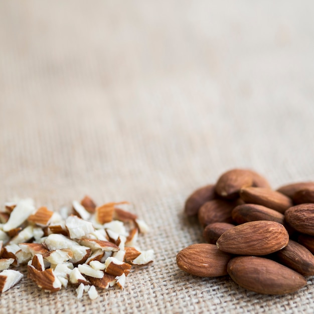 Free photo pile of whole and chopped almonds