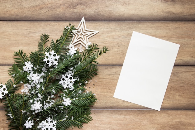 Pine branches on wooden background