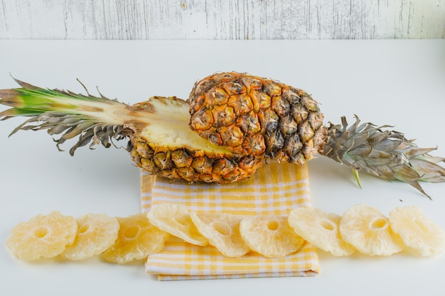 Pineapple with candied rings on kitchen towel