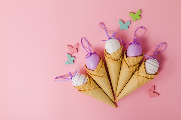 Pink background with cones and easter eggs