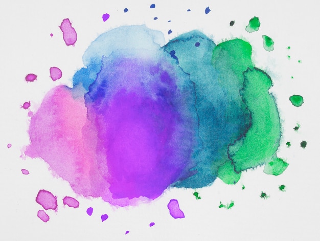 Free photo pink, blue and green mix of paints on white paper