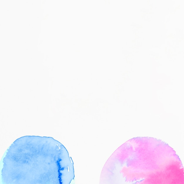 Pink and blue semi circles watercolor on white background