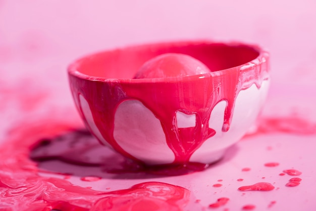 Free photo pink bowl with red paint