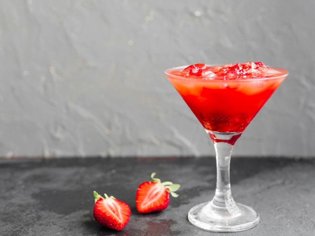 Pink cocktail drink with strawberries