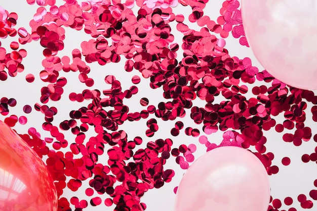 Pink confetti and balloons in layout