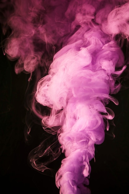 Pink creative smoke on black background