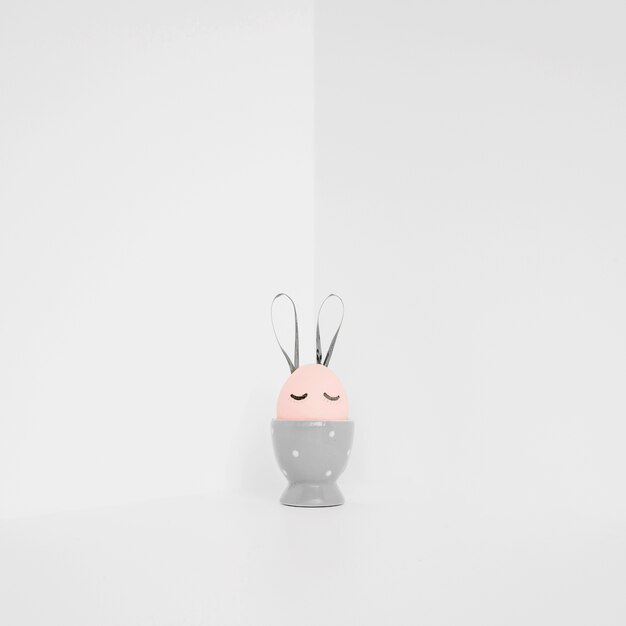 Pink Easter egg in gray holder