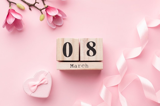 Free photo pink feminine elements with 8 march lettering