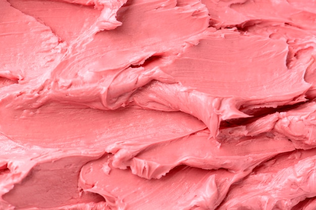 Pink frosting texture background close-up