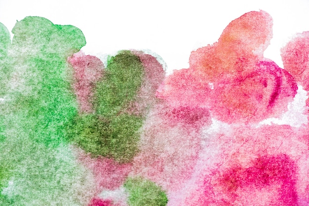 Free photo pink and green watercolor textured background