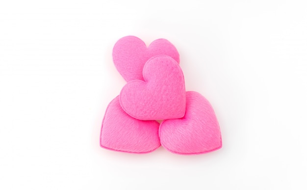 Free photo pink heart pillow on white background .