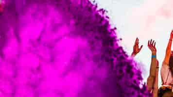 Free photo pink holi color powder explode on the crowd