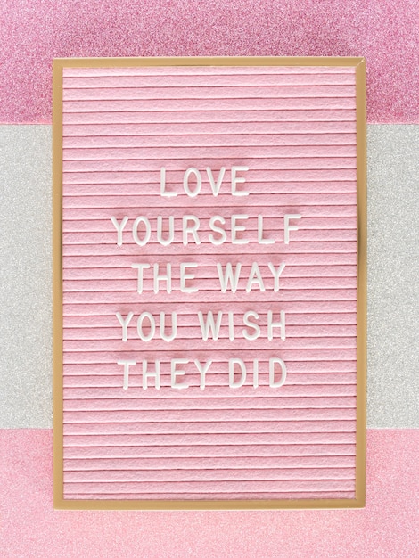 Pink motivational text board top view