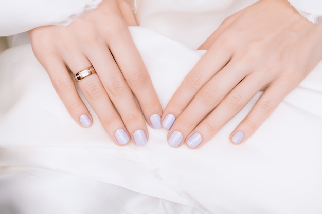 Pink nail design. Female hands with glitter manicure.