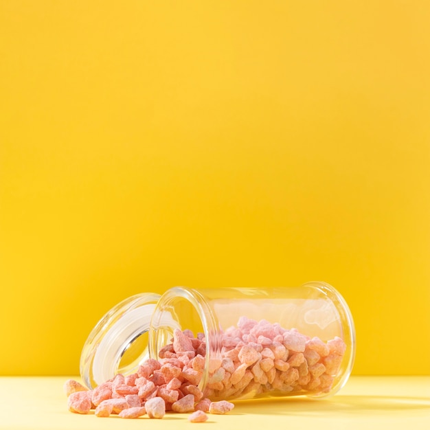 Free photo pink pebbles in transparent jar