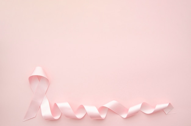 Free Photo pink ribbon on pink background