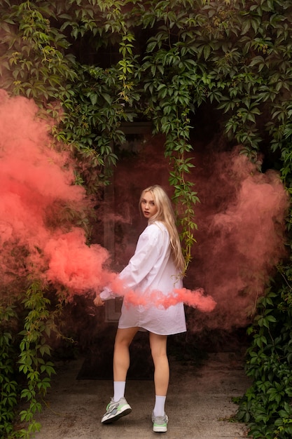 Pink smoke background with young adult