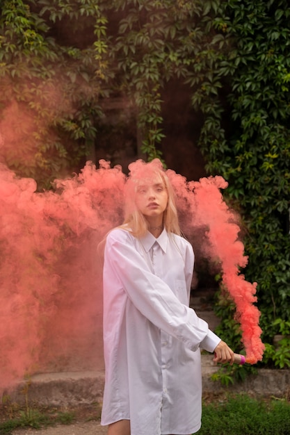 Pink smoke background with young adult