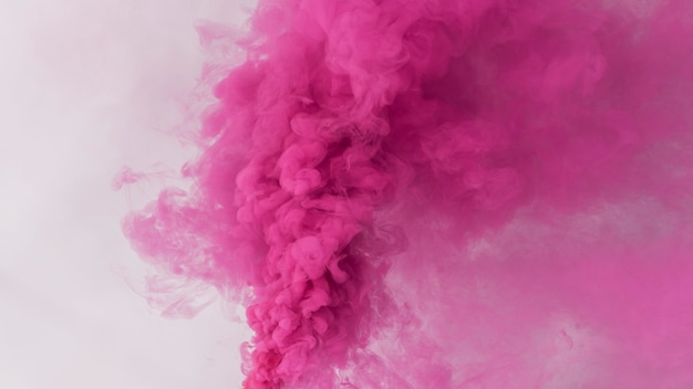 Free photo pink smoke effect on a white wallpaper