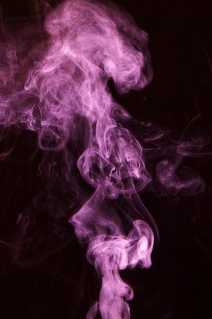 Free photo pink smoke overlay texture movement on black background