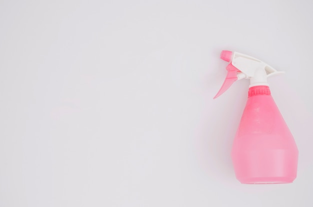 Free photo pink spray bottle on white background