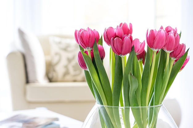 Pink tulips in a contemporary and light living room interior #1