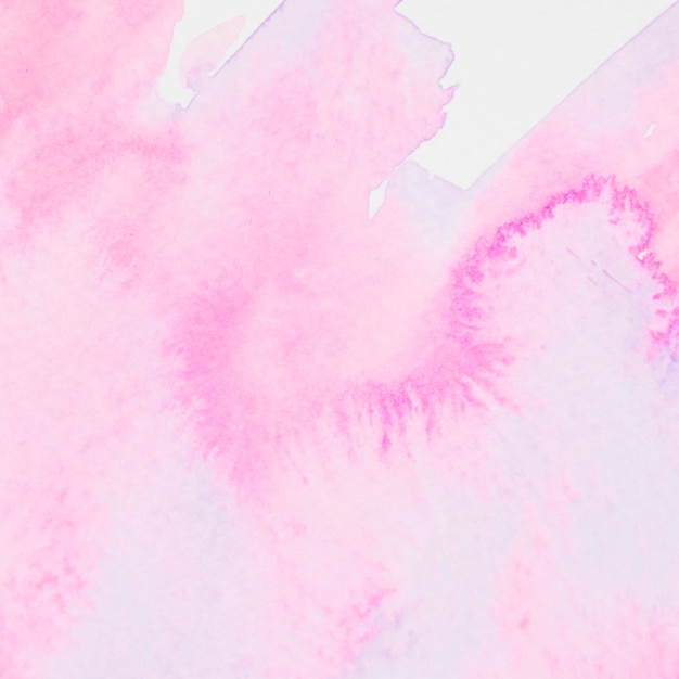 Free photo pink watercolor brushstroke on paper background