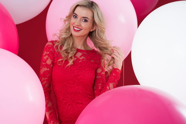 Pink and white balloons and attractive woman