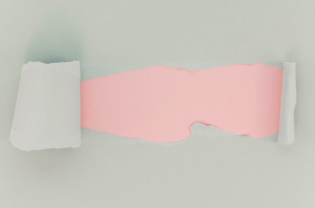 Free photo pink and white torn paper surface