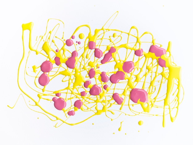 Pink and yellow paint splash on white background